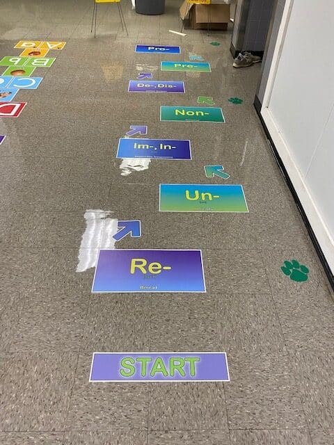 Prefix Sticker on hallway floor