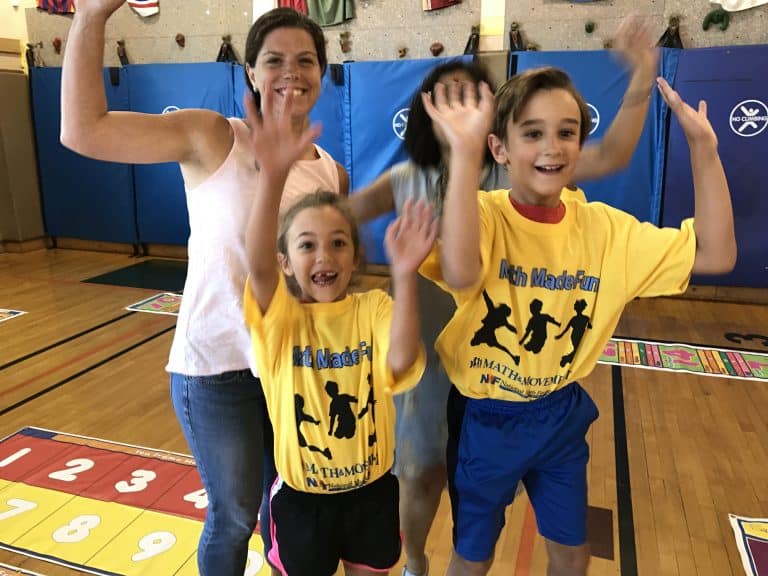 Two students and two teachers jumpinge at a math marathon