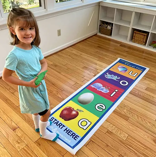 student standing by vowel hop
