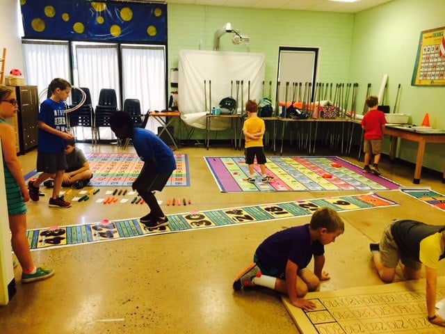 students using mats in classroom