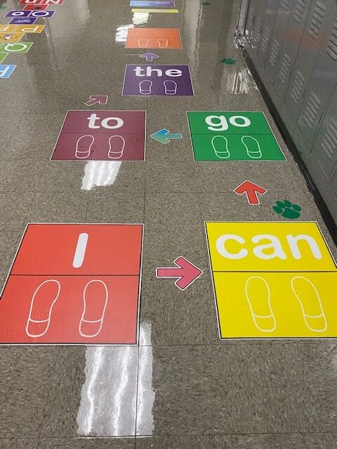 Sentence Hop Stickers set up on hallway floor